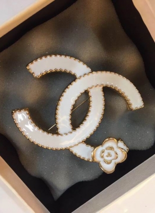 CHANEL brooches