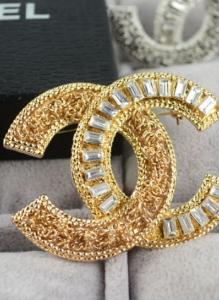 CHANEL brooches
