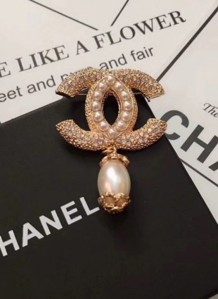 CHANEL brooches