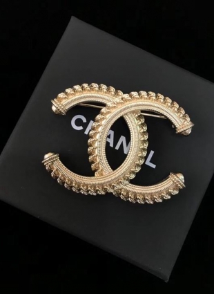 CHANEL brooches